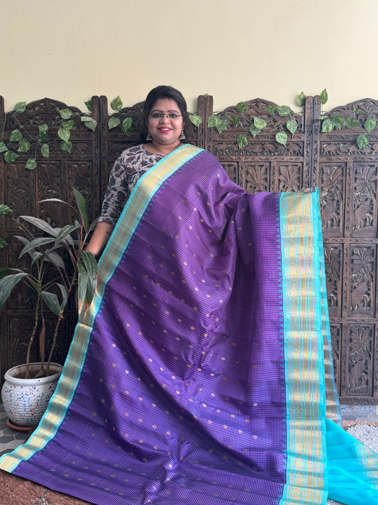 Gadwal Silk Saree Violet Colored Complemented With a Sea Blue Zari Border