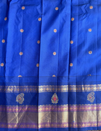 Gadwal Pattu Saree Cream colored saree complemented with a Ink Blue Zari border