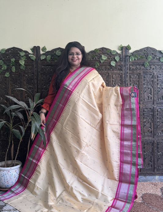 Gadwal Pattu Saree Cream colored saree complemented with a Pink Zari border