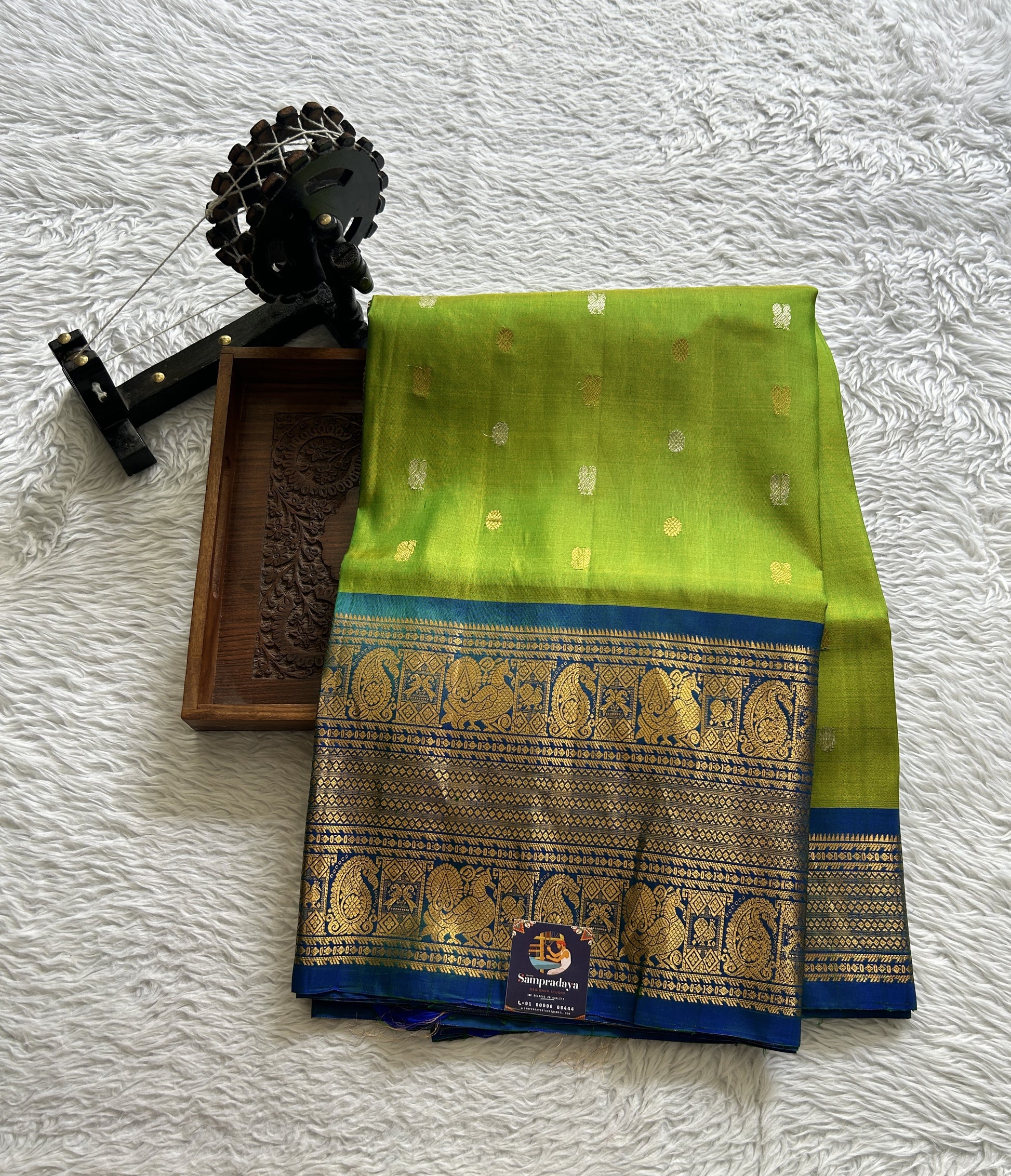 Gadwal Pattu Saree Parrot Green Colored Complemented With a Blue Color Zari Border - Sampradaya Designer Studio