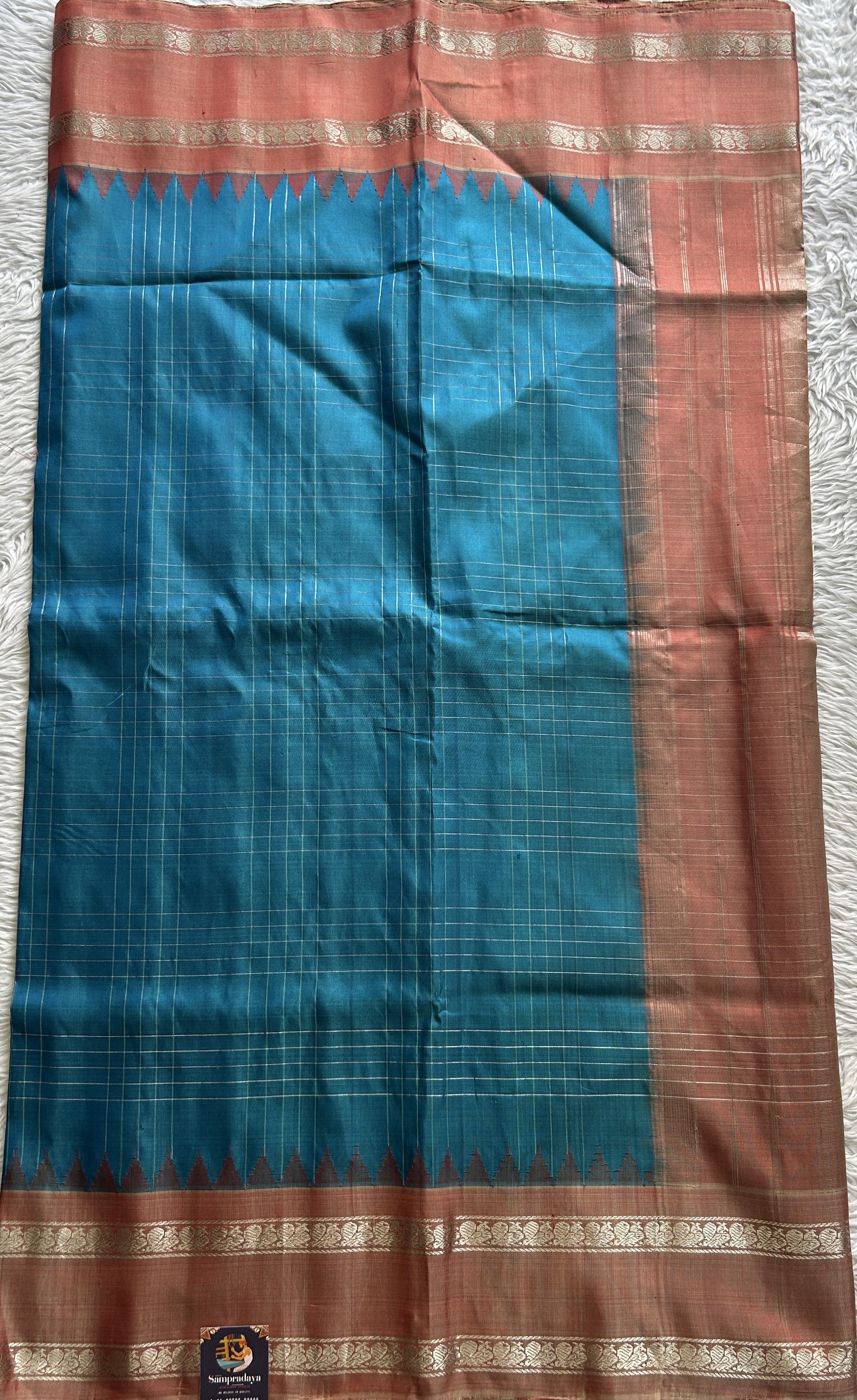 Gadwal Pattu Saree Sea Blue Colored Complemented With a Peach Color Zari Border - Sampradaya Designer Studio