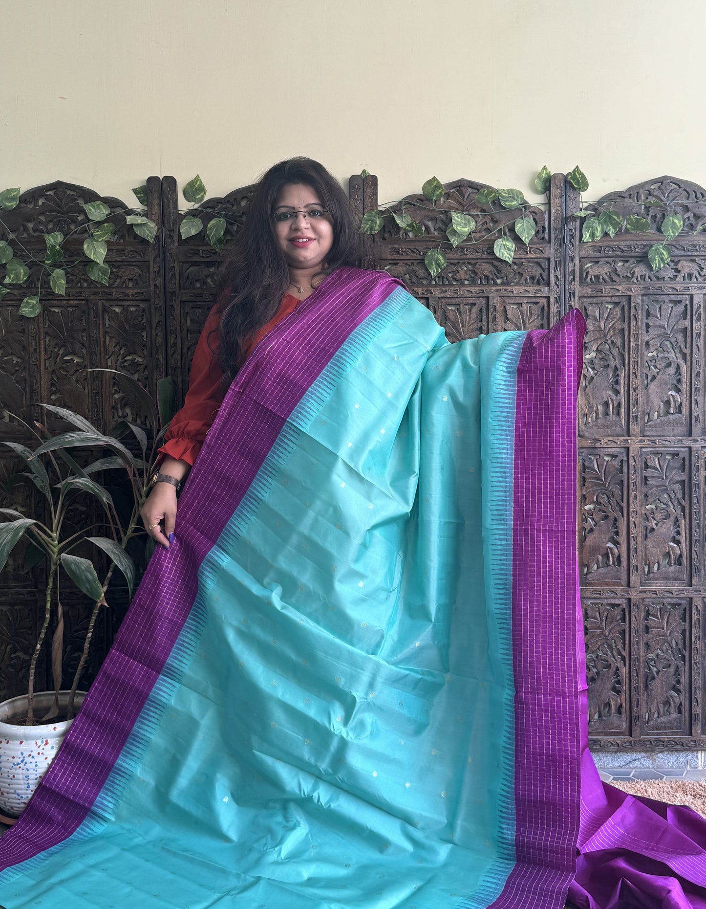 Gadwal Pattu Saree Light Turquoise Blue colored saree complemented with a Purple Checks border