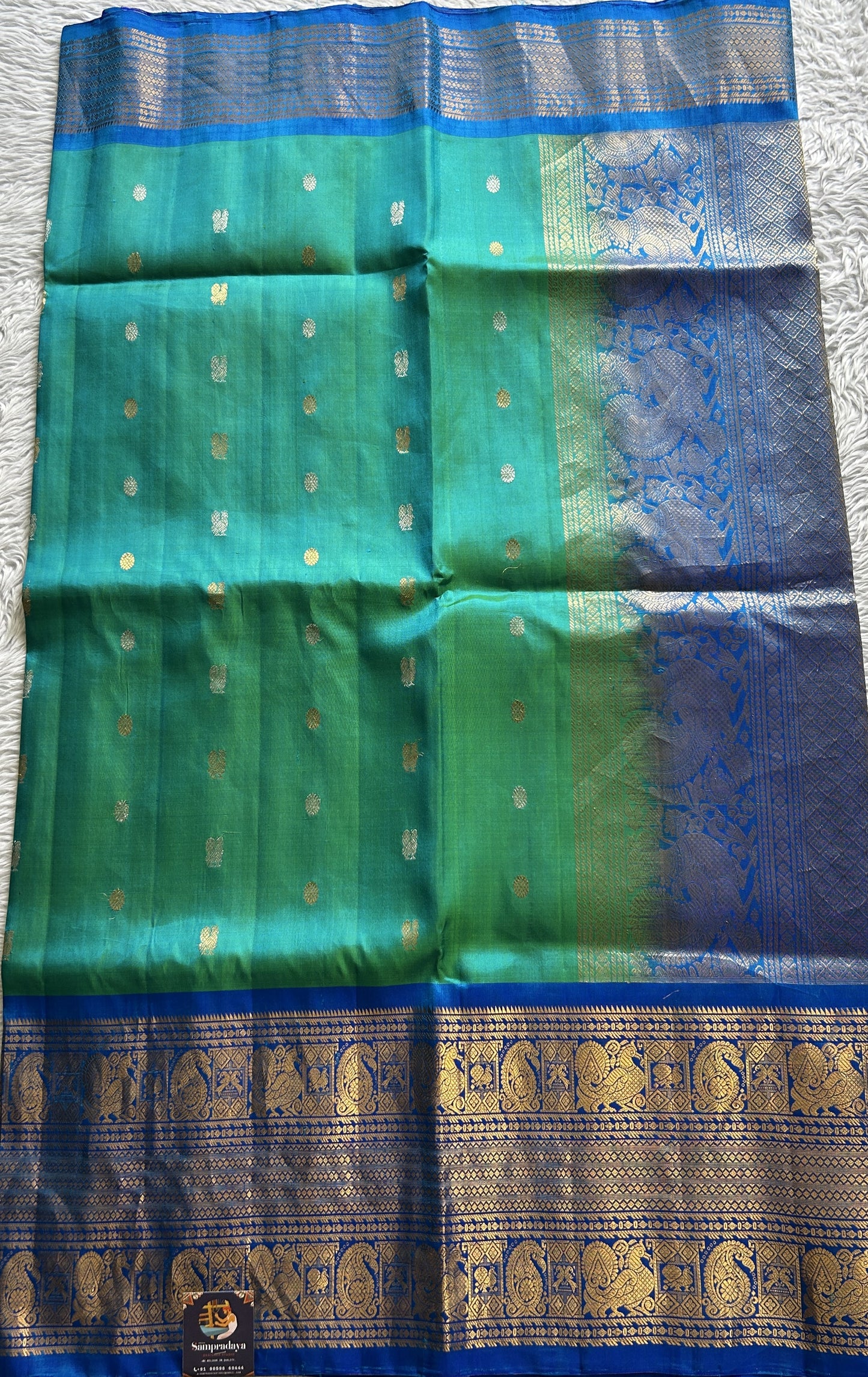 Gadwal Pattu Saree Aqua Green Colored Complemented With a Blue Color Zari Border - Sampradaya Designer Studio