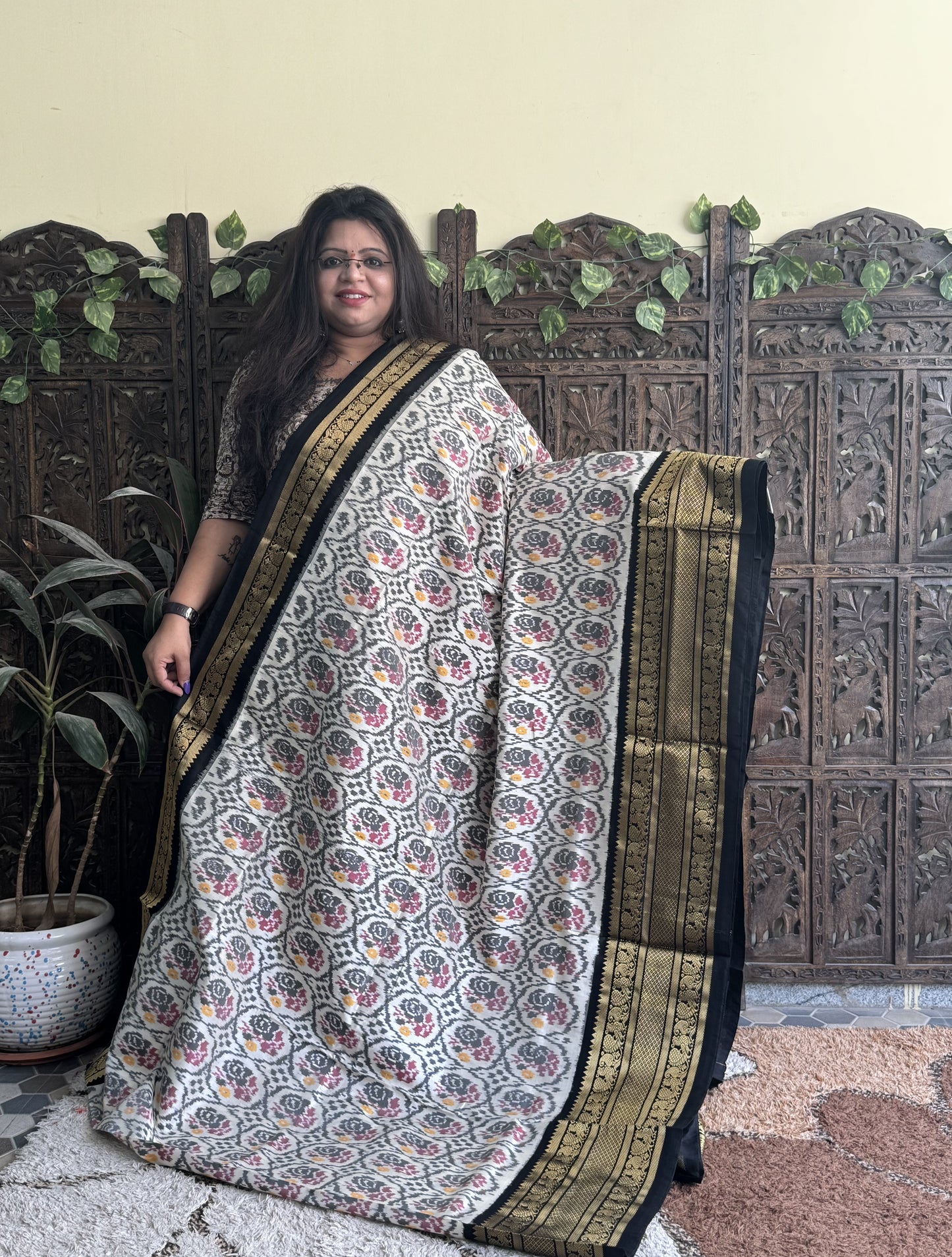 Ikkat Pattu Saree Off White colored complemented with a Kanchi border.