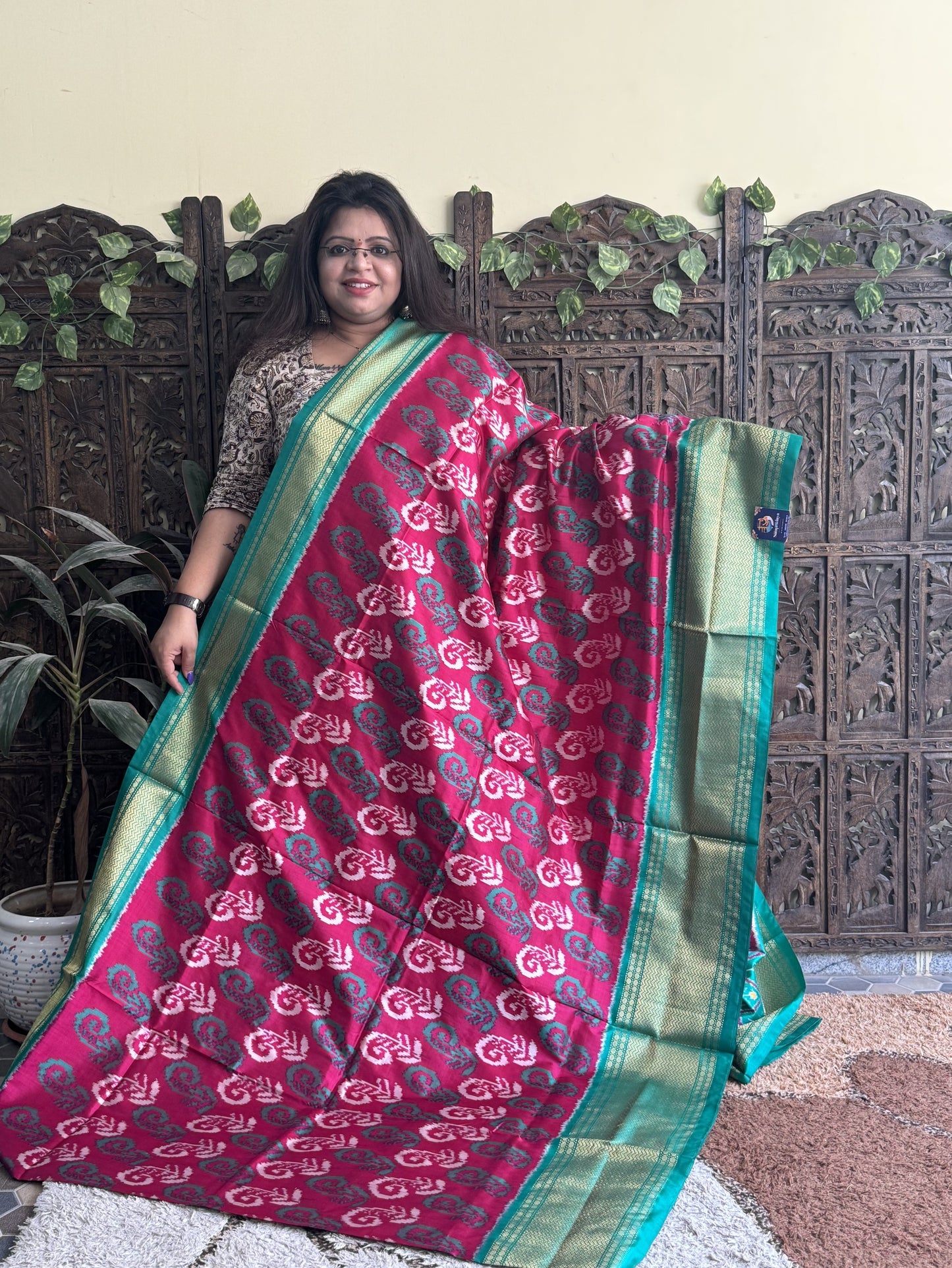 Ikkat Pattu Saree Dark Pink colored complemented with a Kanchi border.