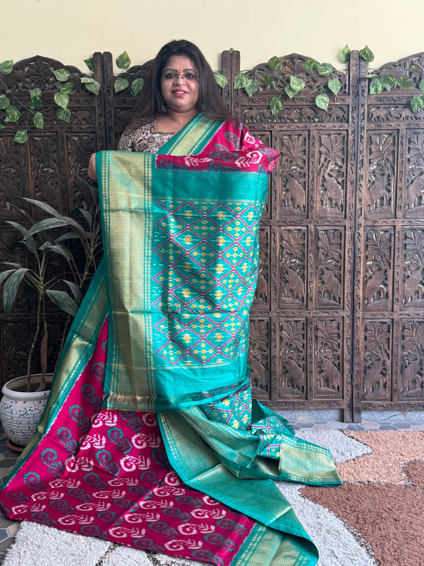 Ikkat Pattu Saree Dark Pink colored complemented with a Kanchi border.