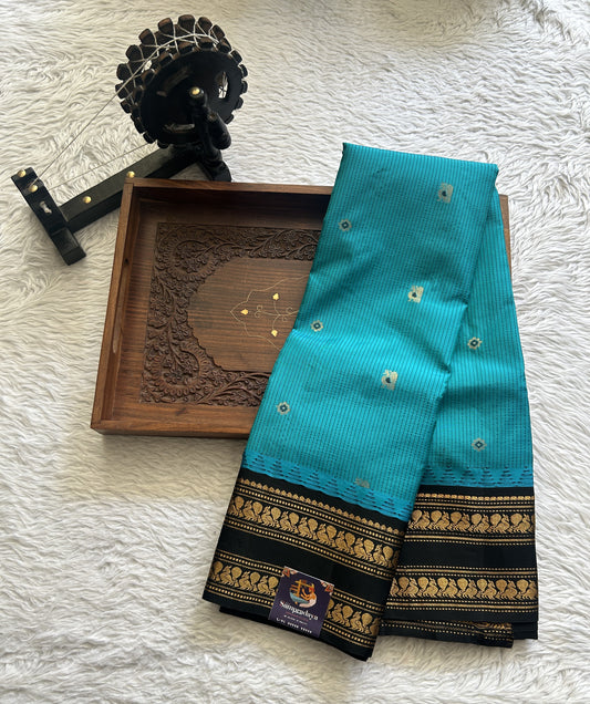 Gadwal Silk Saree Turquoise Blue Colored complemented with a Black Color Zari Border. - Sampradaya Designer Studio