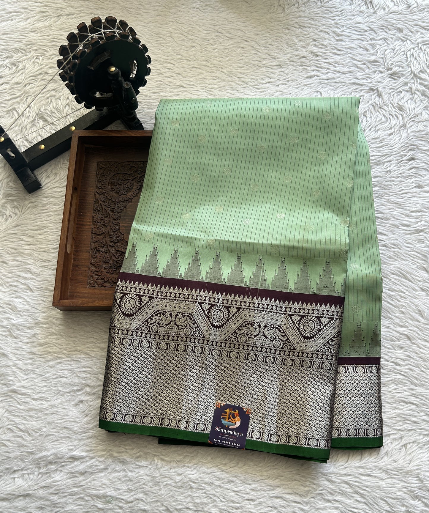 Gadwal Silk Saree Light Green Colored complemented with a Brown Color Zari Border. - Sampradaya Designer Studio