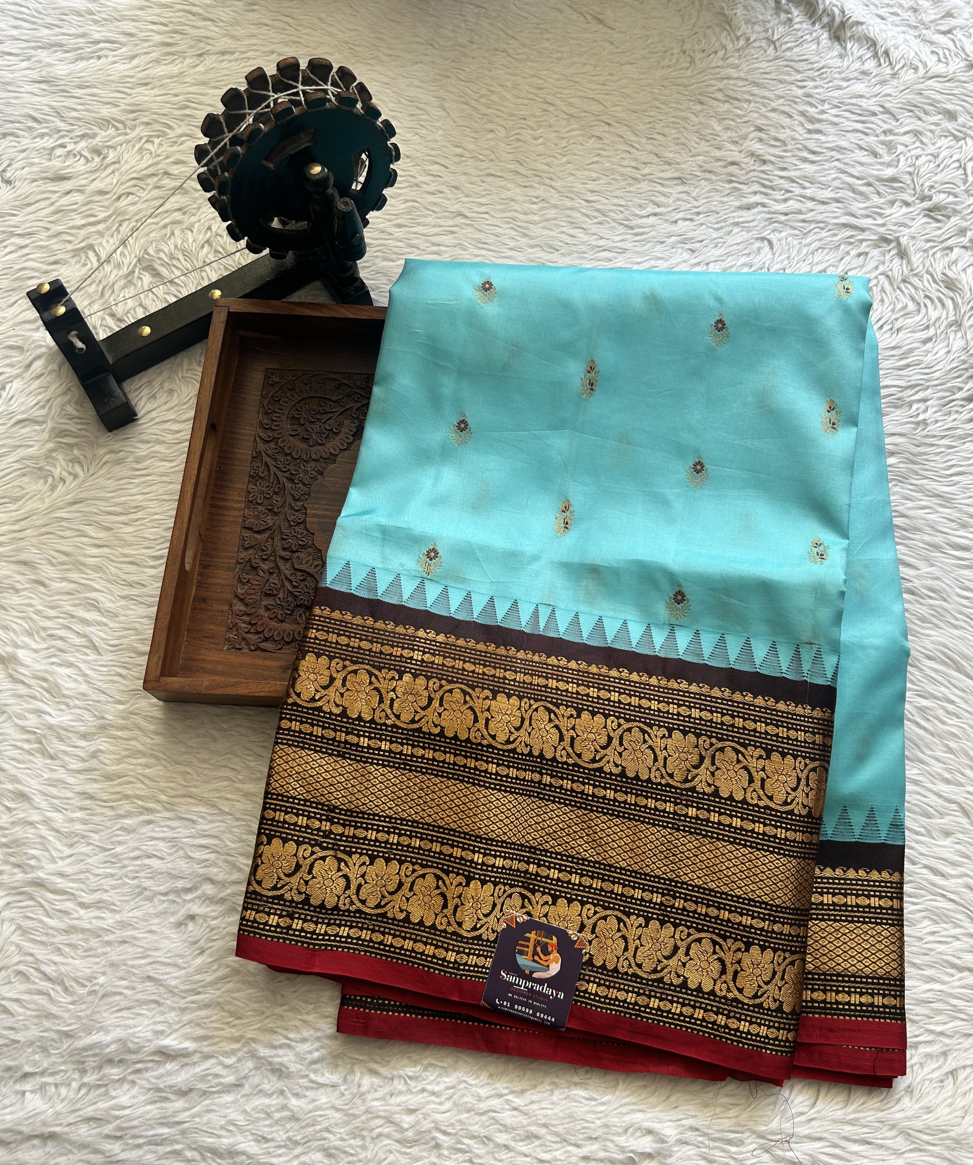 Gadwal Silk Saree Sky Blue Colored complemented with a Brown Color Zari Border. - Sampradaya Designer Studio