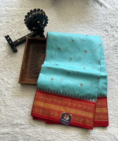 Gadwal Silk Saree Sky Blue Colored complemented with a Red Color Zari Border. - Sampradaya Designer Studio