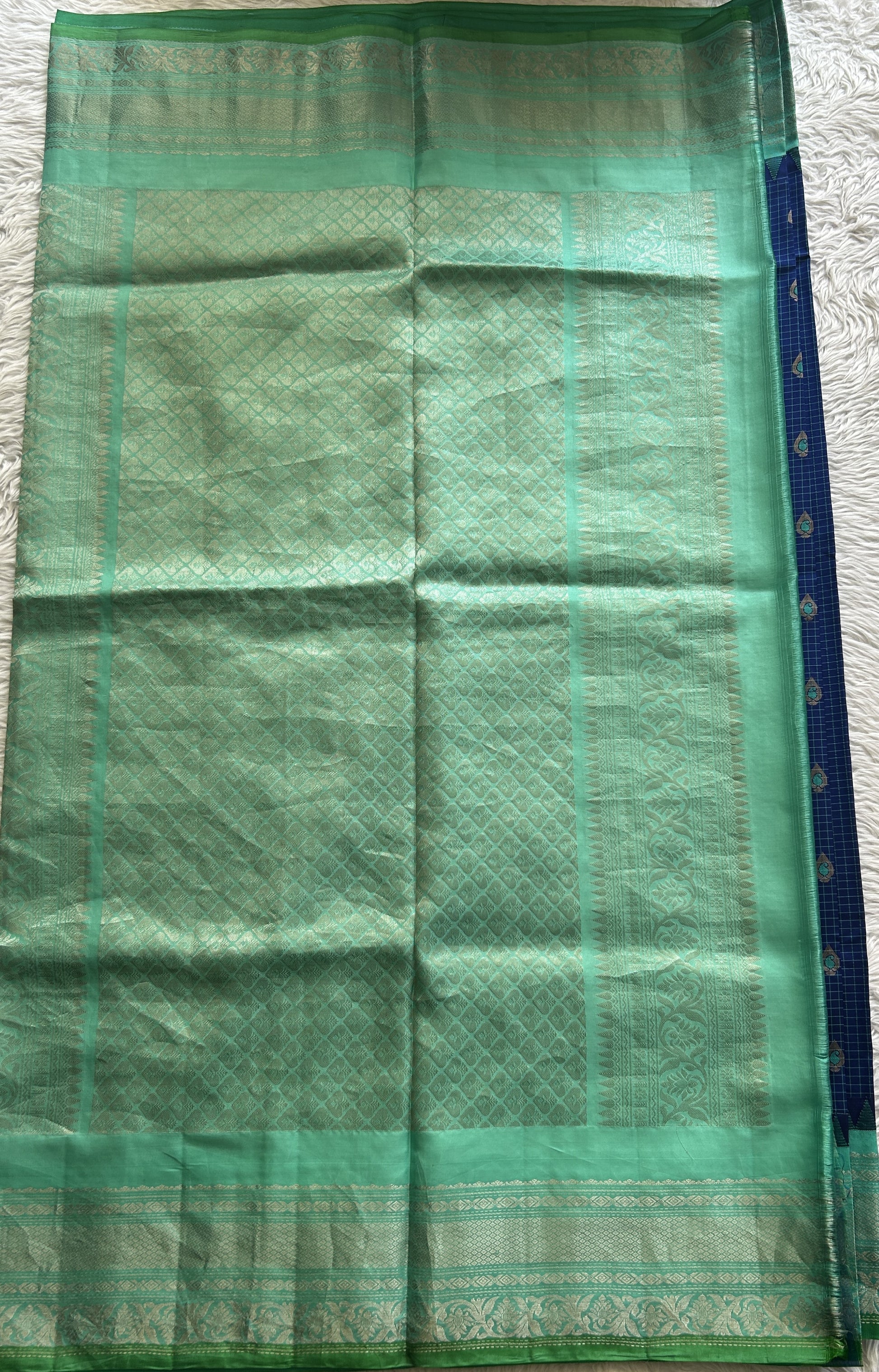 Gadwal Silk Saree Ink Blue Colored complemented with a Turquoise Blue Color Zari Border. - Sampradaya Designer Studio