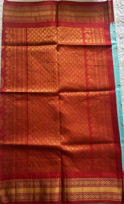 Gadwal Silk Saree Sky Blue Colored complemented with a Red Color Zari Border. - Sampradaya Designer Studio