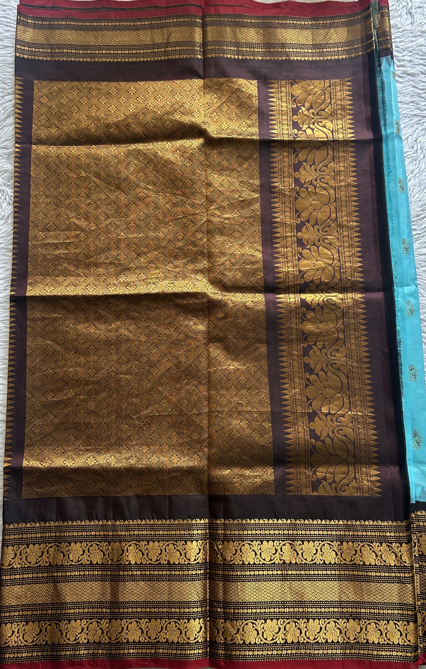 Gadwal Silk Saree Sky Blue Colored complemented with a Brown Color Zari Border. - Sampradaya Designer Studio