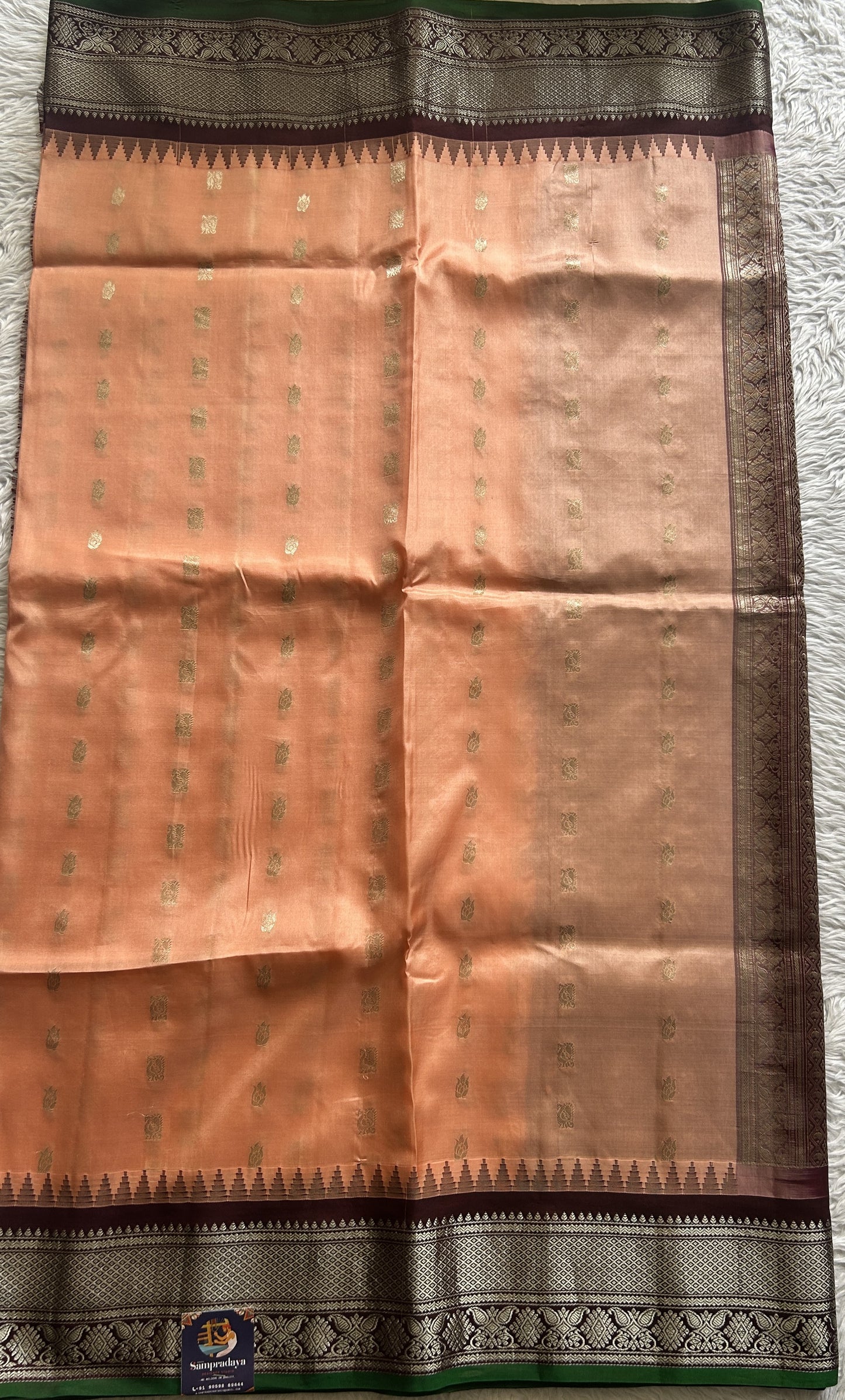 Gadwal Silk Saree Peach Colored complemented with a Brown Color Zari Border. - Sampradaya Designer Studio