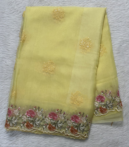 Soft Organza Designer Saree Light Yellow colored Saree complemented with a Machine Embroidery border. - Sampradaya Designer Studio