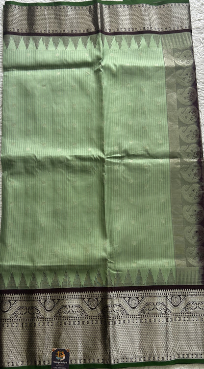 Gadwal Silk Saree Light Green Colored complemented with a Brown Color Zari Border. - Sampradaya Designer Studio