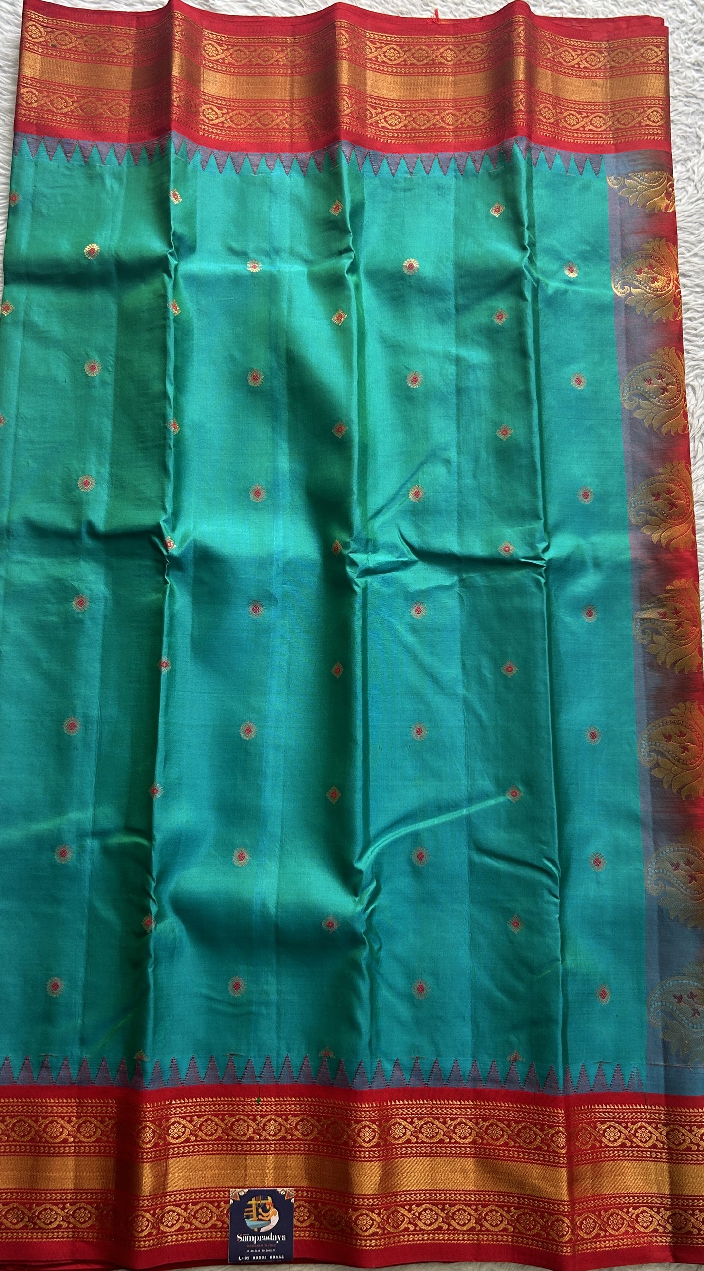 Gadwal Silk Saree Blue Colored complemented with a Red Color Zari Border. - Sampradaya Designer Studio