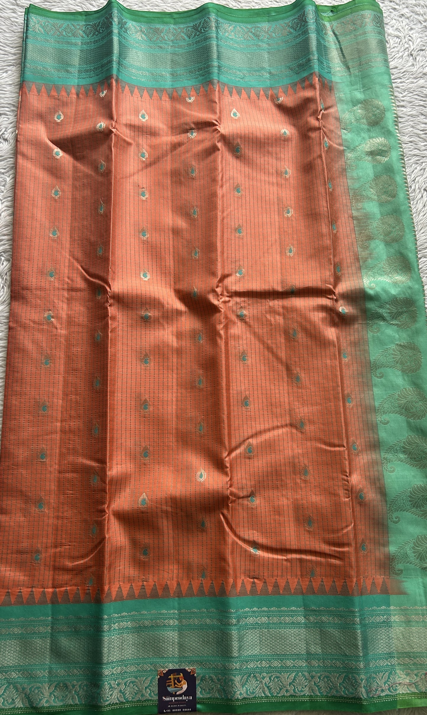 Gadwal Silk Saree Peach Colored complemented with a Sea Blue Color Zari Border. - Sampradaya Designer Studio