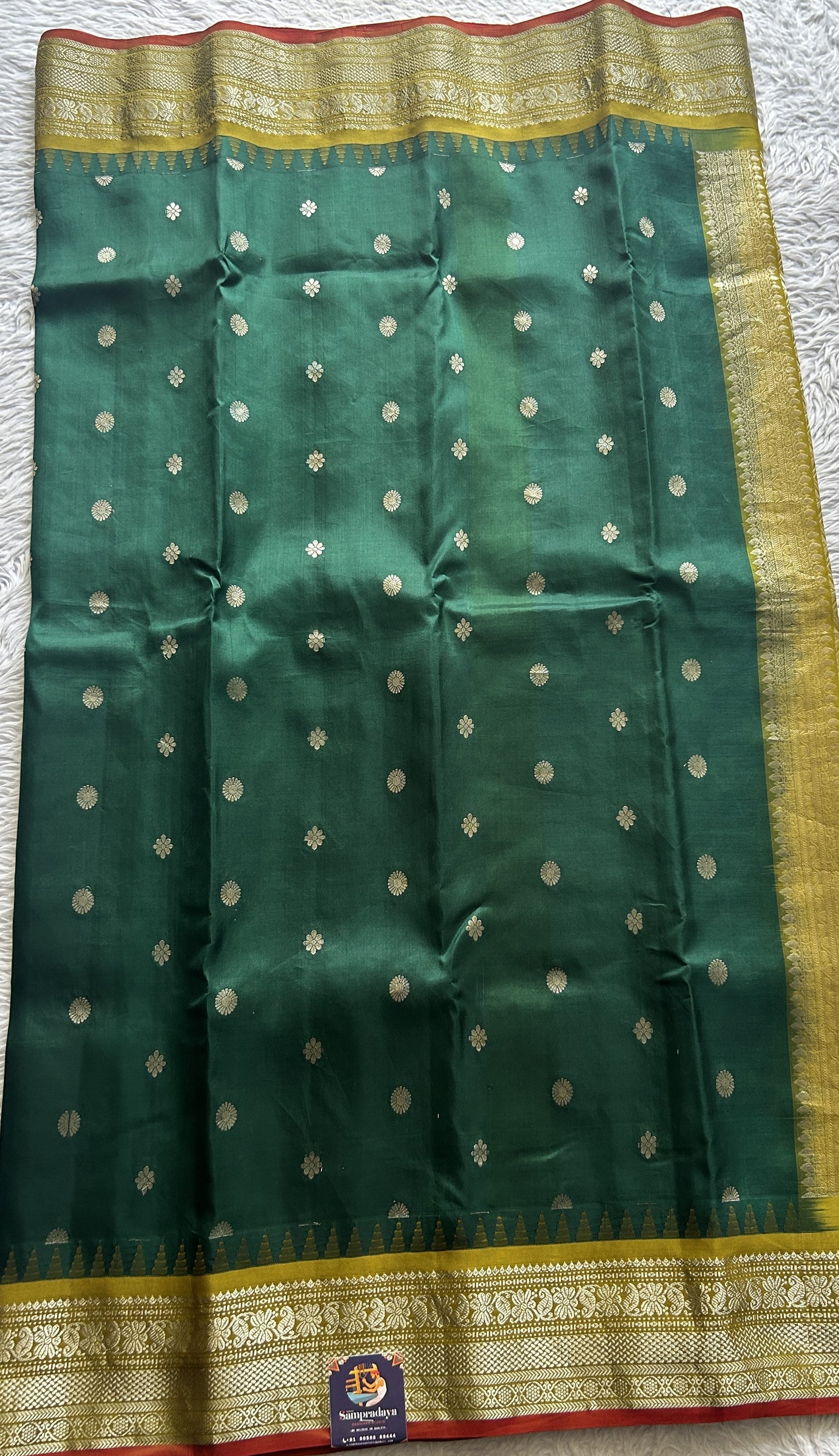 Gadwal Silk Saree Bottle Green Colored complemented with a Olive Green Color Zari Border. - Sampradaya Designer Studio