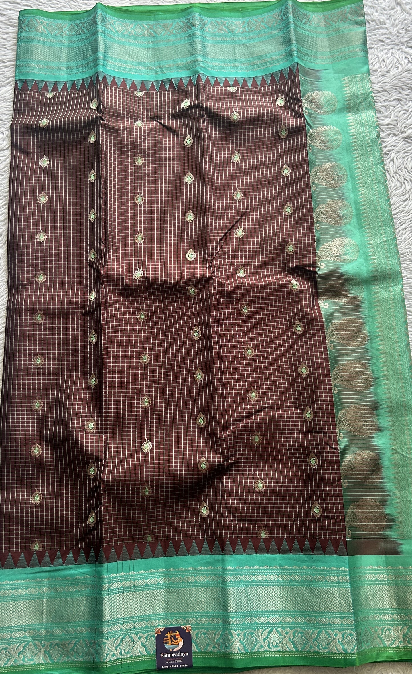 Gadwal Silk Saree Brown Colored complemented with a Sea Blue Color Zari Border. - Sampradaya Designer Studio