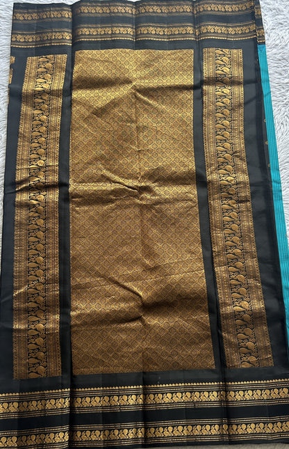 Gadwal Silk Saree Turquoise Blue Colored complemented with a Black Color Zari Border. - Sampradaya Designer Studio