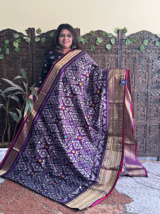 Ikkat Pattu Saree Violet colored complemented with a Kanchi border.