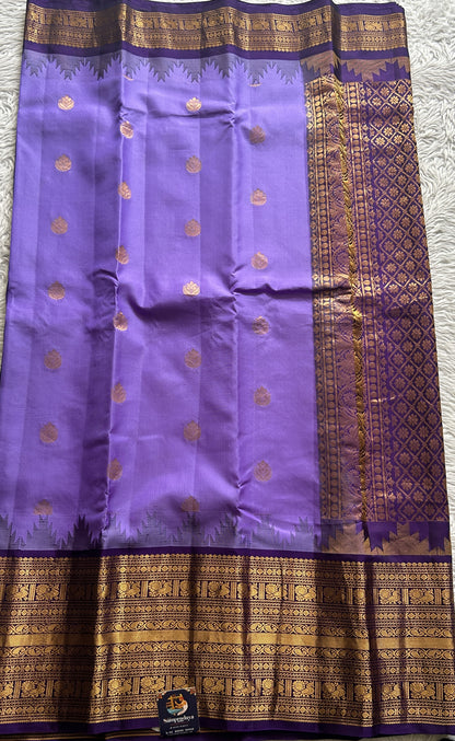 Gadwal Silk Saree Lavender Colored complemented with a Zari Border. - Sampradaya Designer Studio