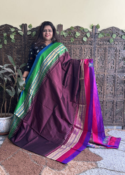 Ikkat Pattu Saree Dark Maroon colored complemented with a Kanchi border.