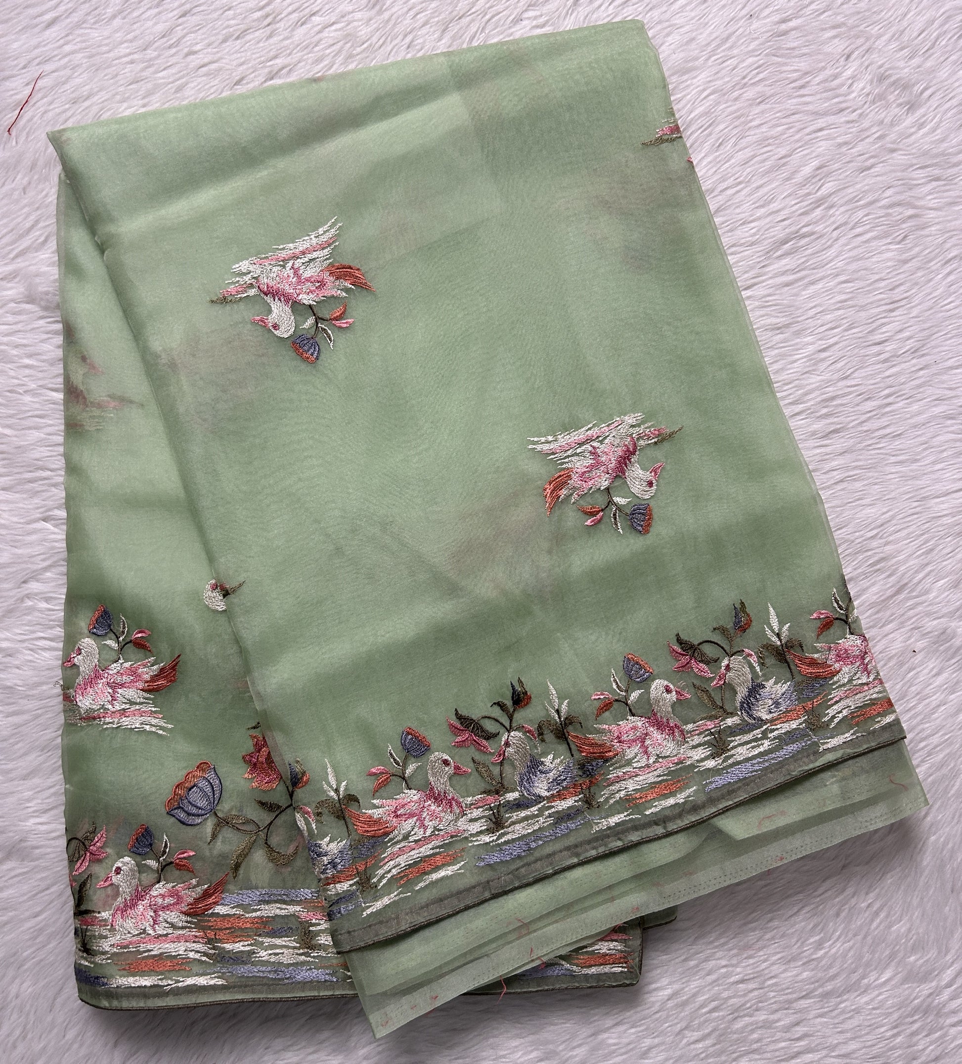 Soft Organza Designer Saree Light Green colored Saree complemented with a Machine Embroidery border. - Sampradaya Designer Studio