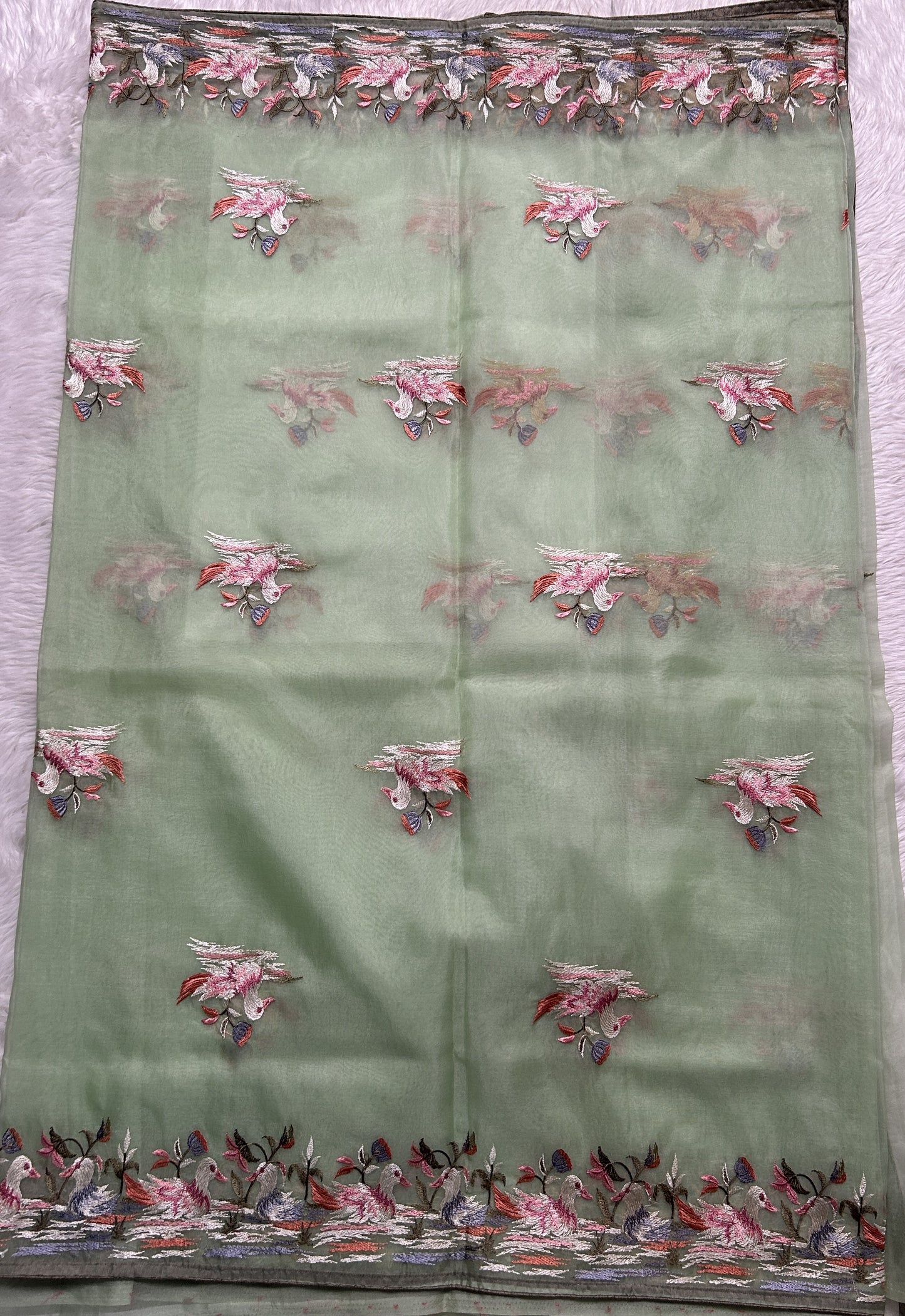 Soft Organza Designer Saree Light Green colored Saree complemented with a Machine Embroidery border. - Sampradaya Designer Studio