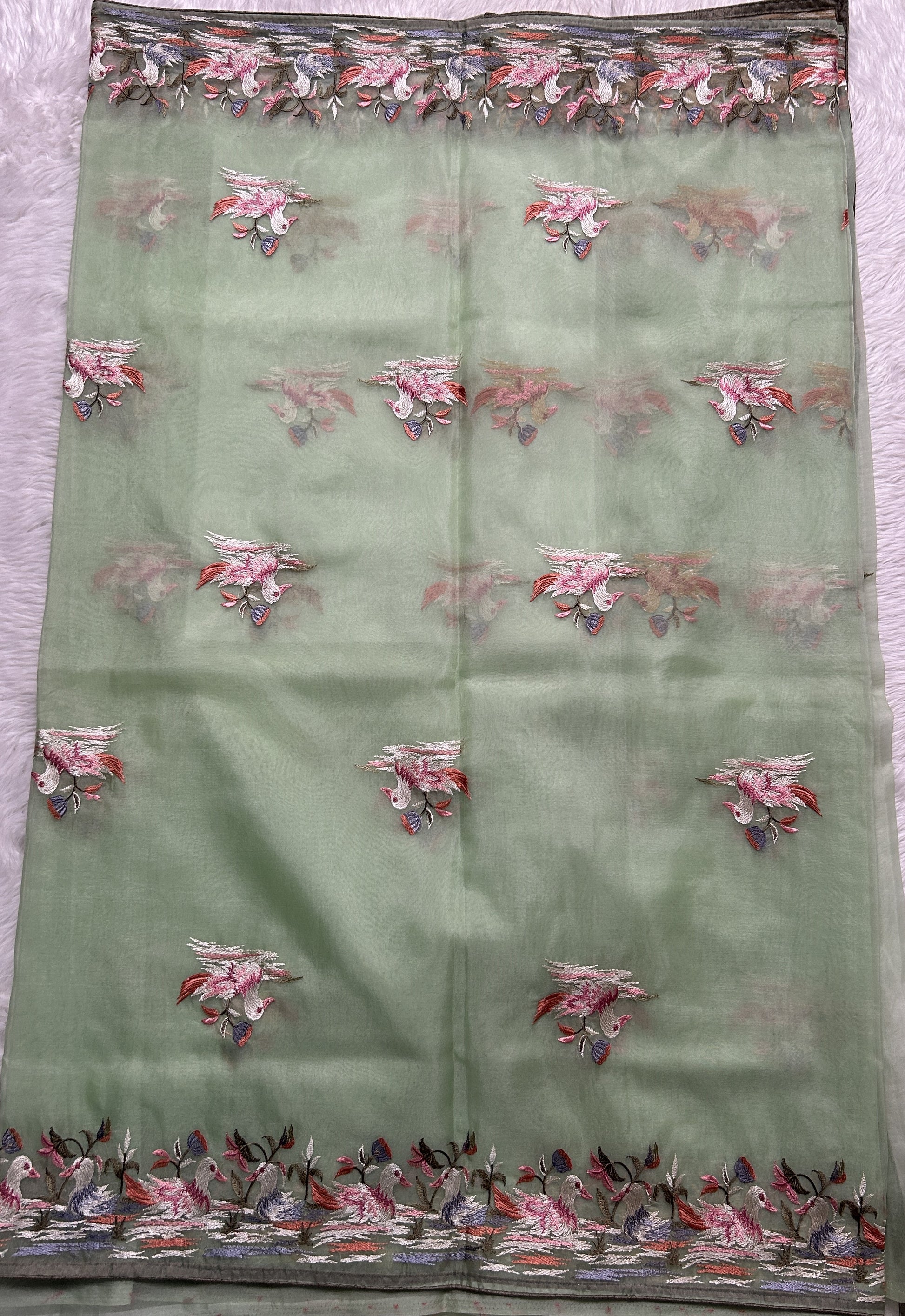 Soft Organza Designer Saree Light Green colored Saree complemented with a Machine Embroidery border. - Sampradaya Designer Studio