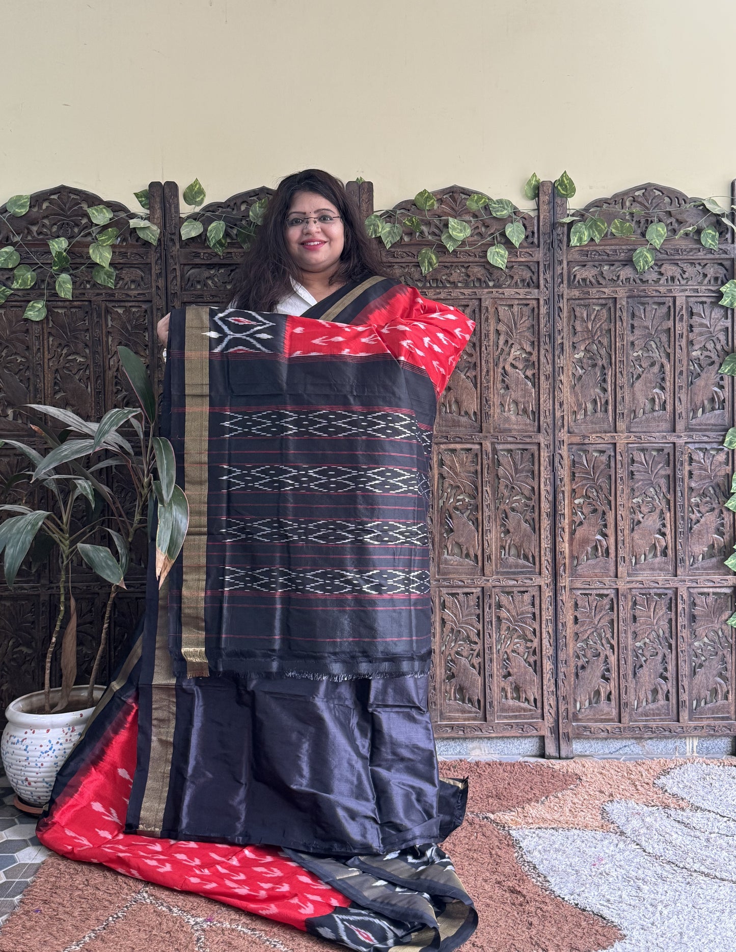 Ikkat Pattu Saree Red colored complemented with a Ikkat Zari border.