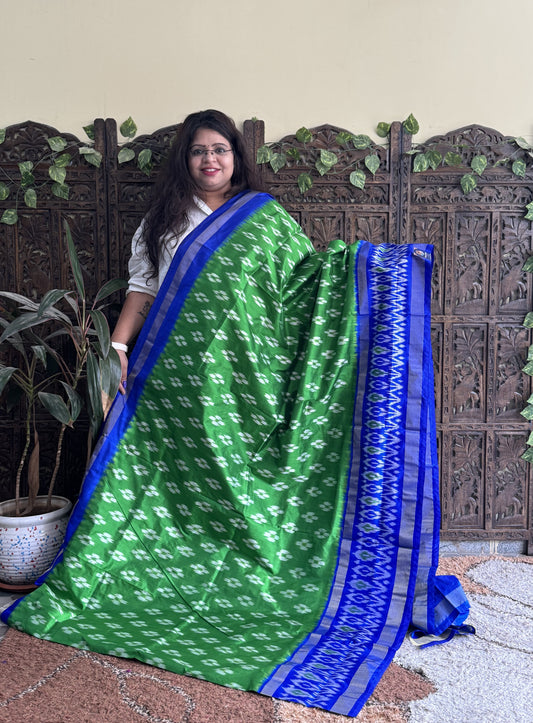 Ikkat Pattu Saree Green colored complemented with a Ikkat Zari border.