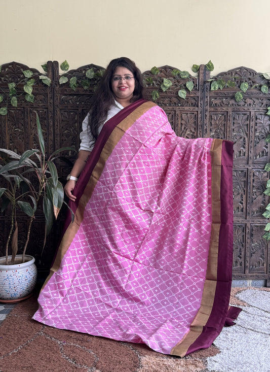 Ikkat Pattu Saree Light Pink colored complemented with a Zari border.