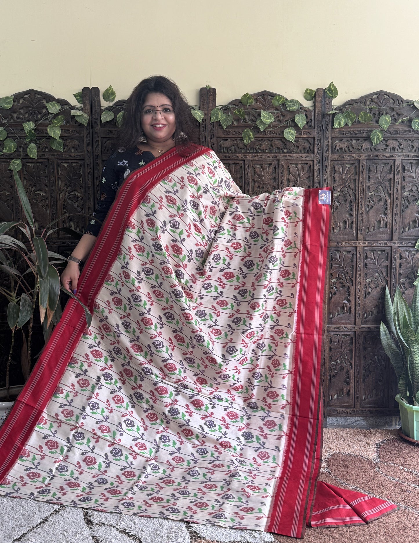 Ikkat Pattu Saree Cream colored complemented with a Patola border.