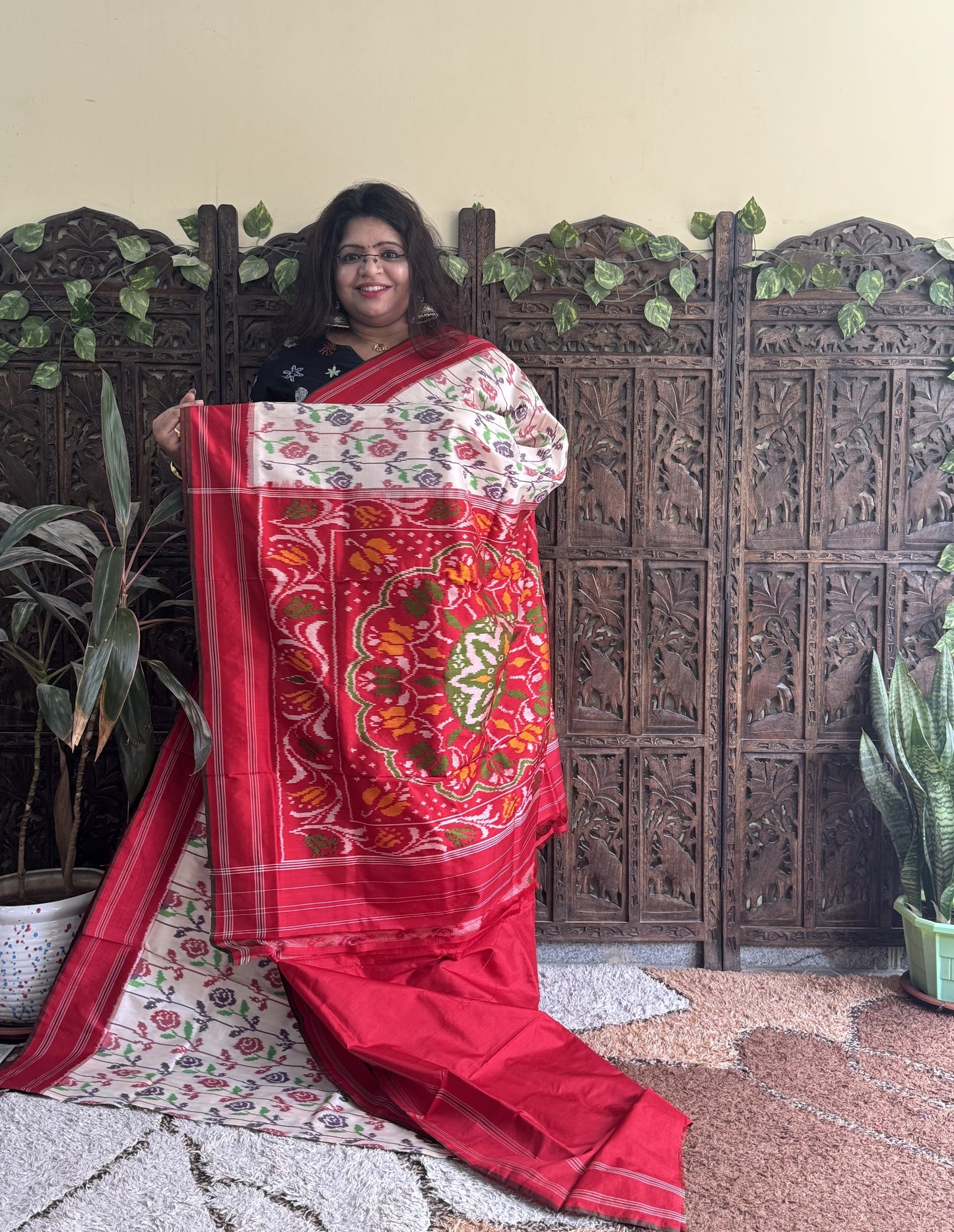 Ikkat Pattu Saree Cream colored complemented with a Patola border.