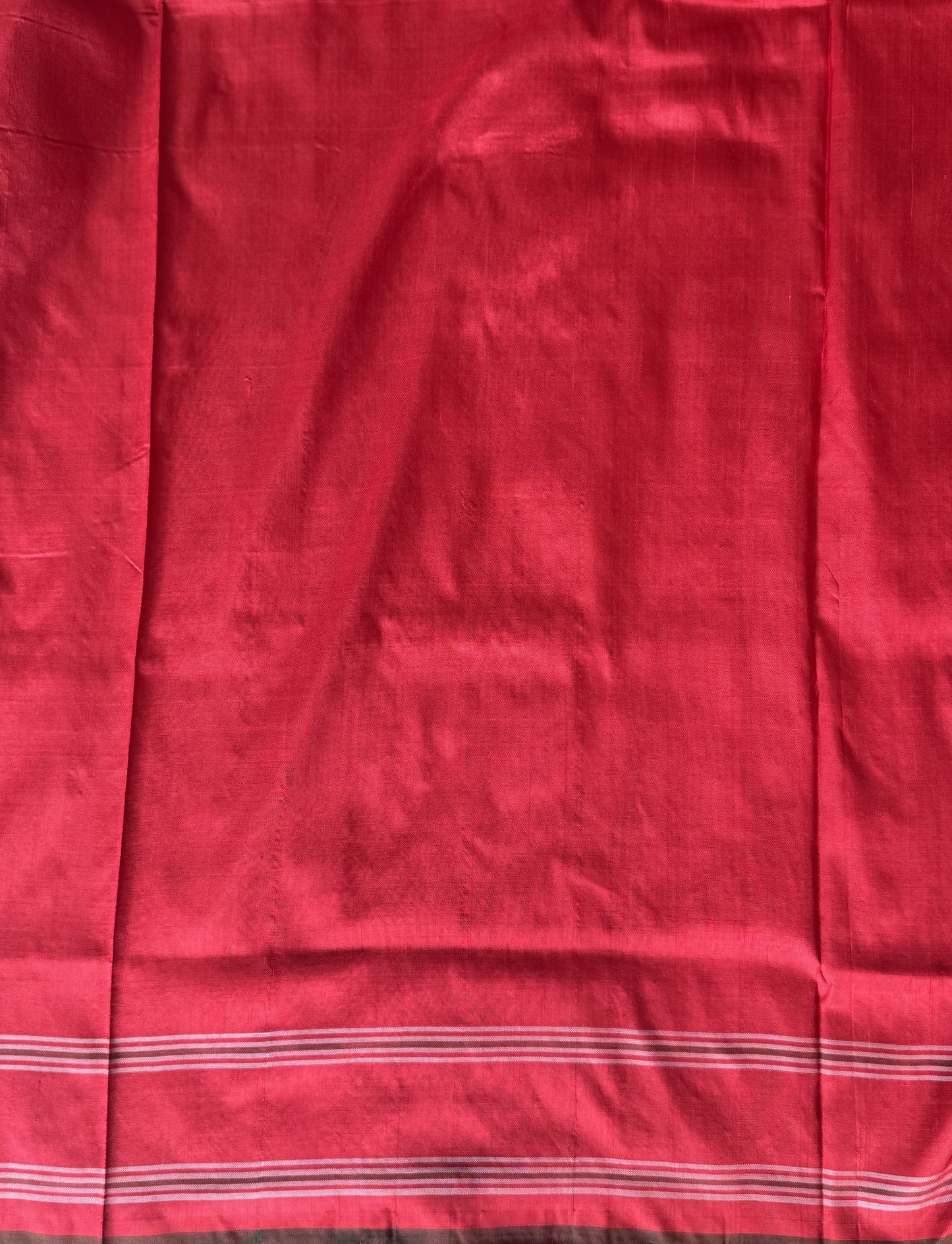 Ikkat Pattu Saree Cream colored complemented with a Patola border.