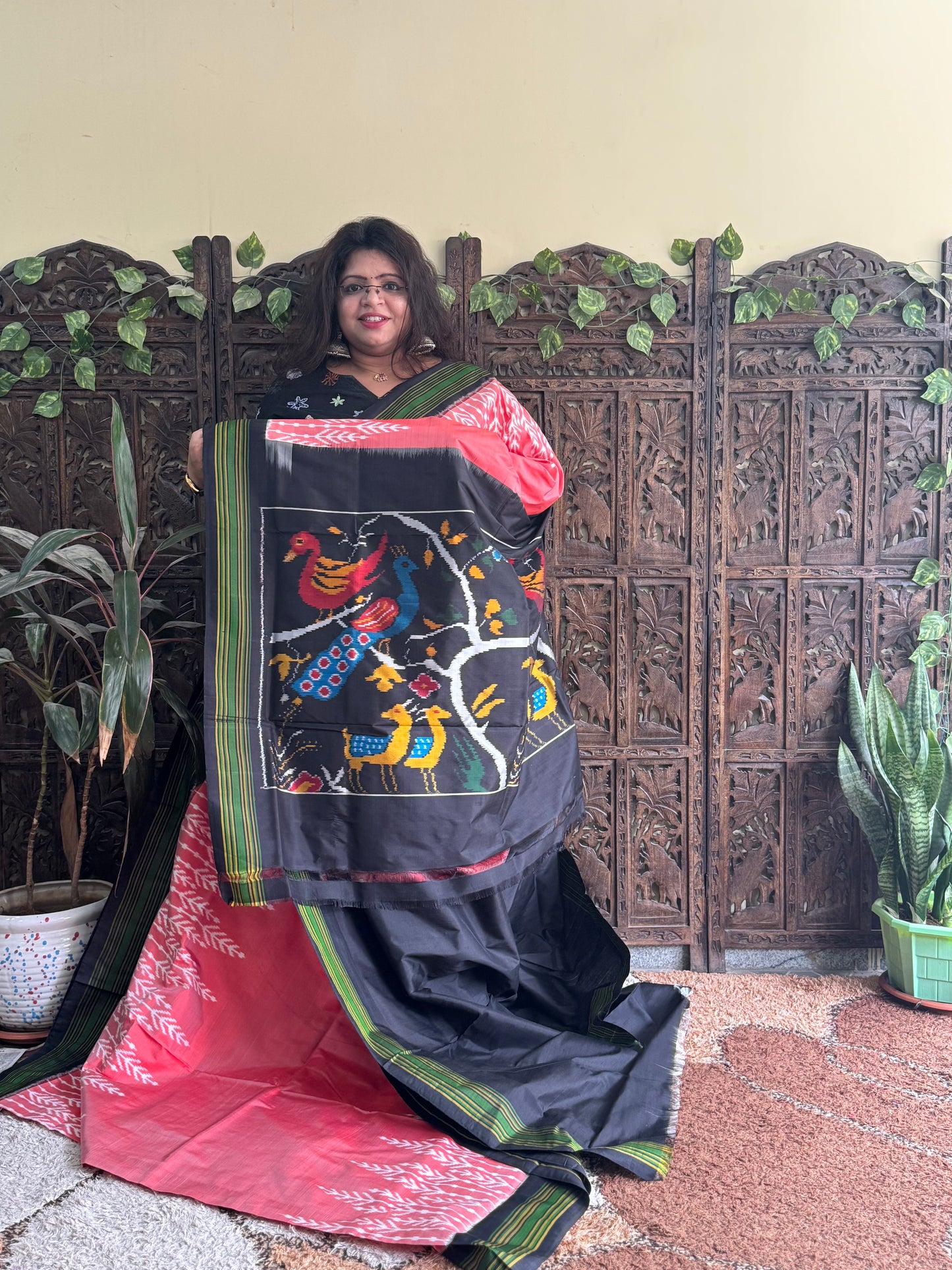 Ikkat Pattu Saree Peach colored complemented with a Patola border.