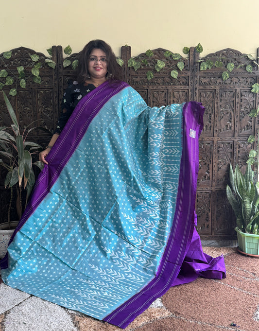 Ikkat Pattu Saree Light Blue colored complemented with a Patola border.