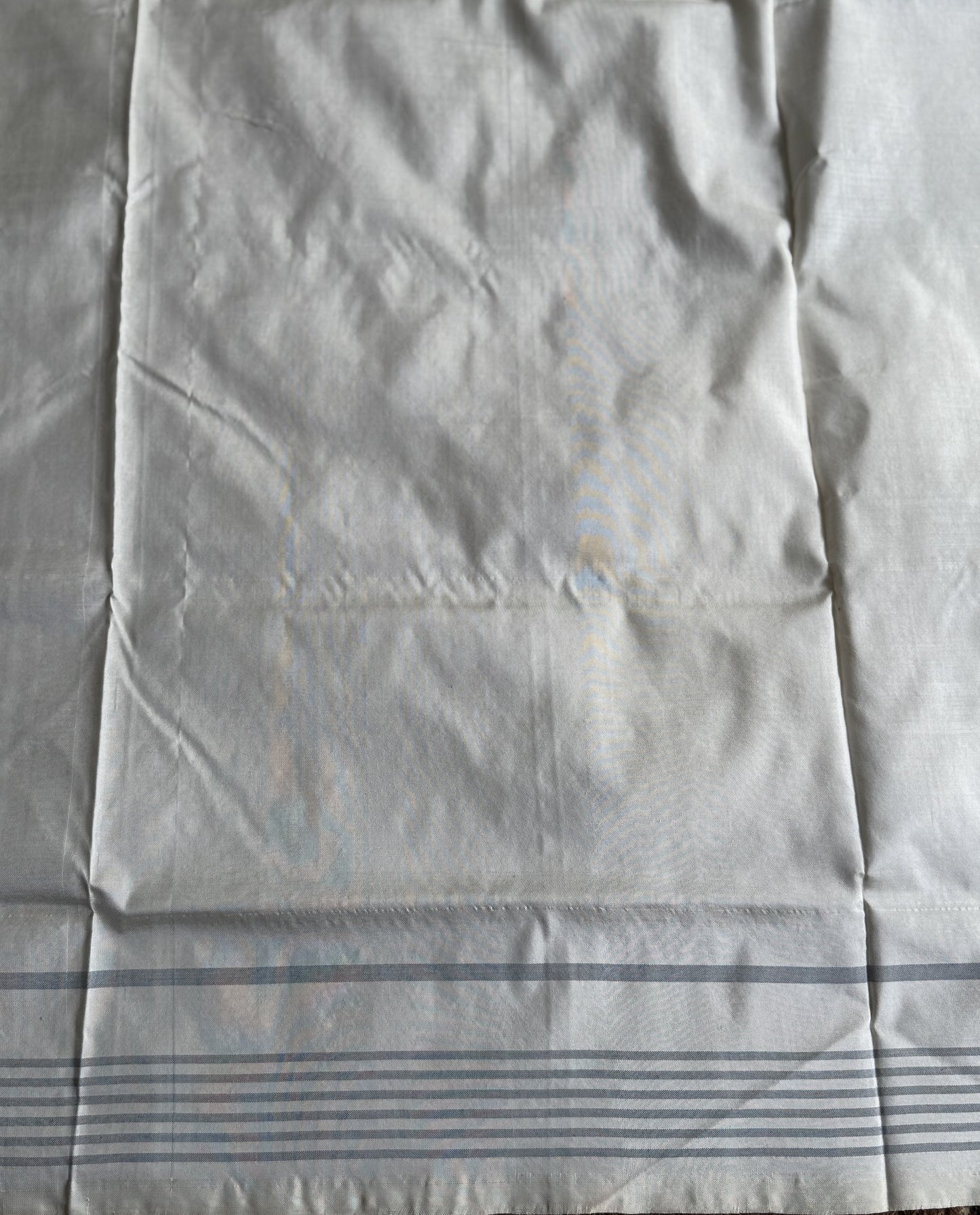 Ikkat Pattu Saree Gray colored complemented with a Patola border.