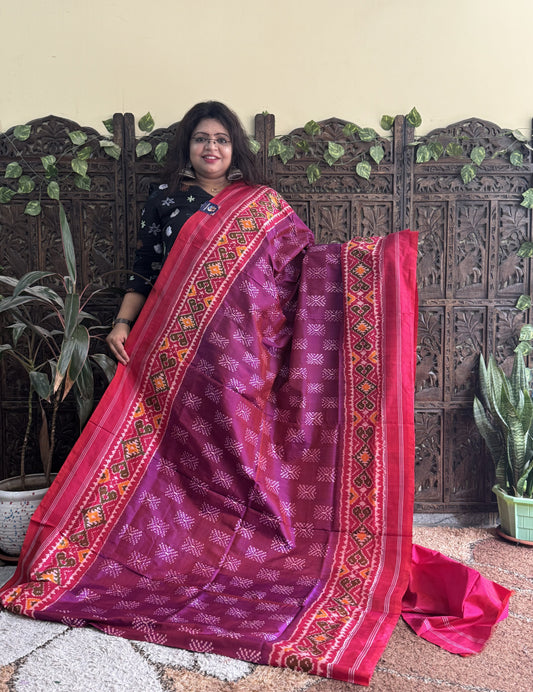 Ikkat Pattu Saree Wine colored complemented with a Patola border.