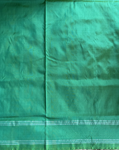 Ikkat Pattu Saree Parrot Green colored complemented with a Patola border.