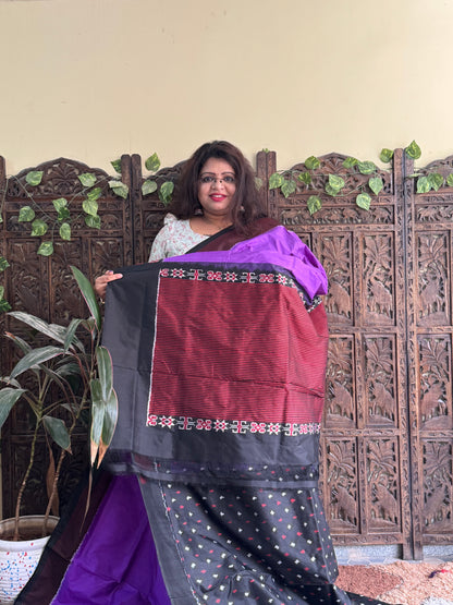 Ikkat Pattu Saree Purple colored complemented with a Checks border.