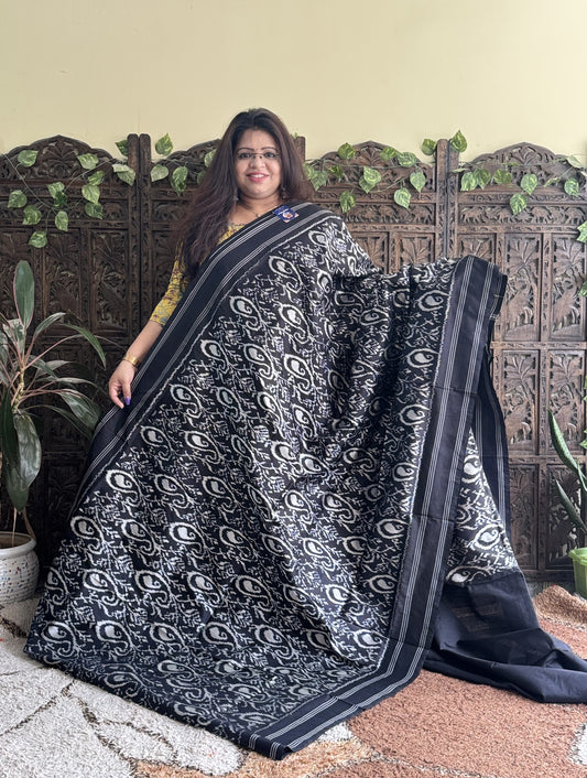 Ikkat Pattu Saree Charcoal colored complemented with a Patola border.