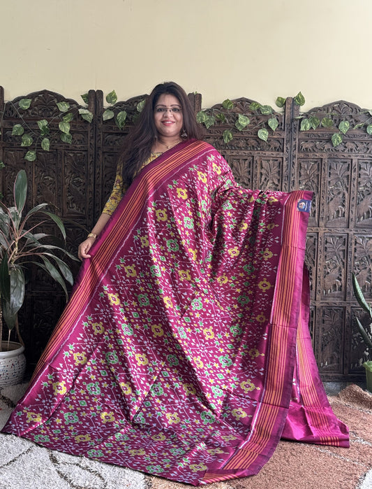 Ikkat Pattu Saree Rose Pink colored complemented with a Patola border.