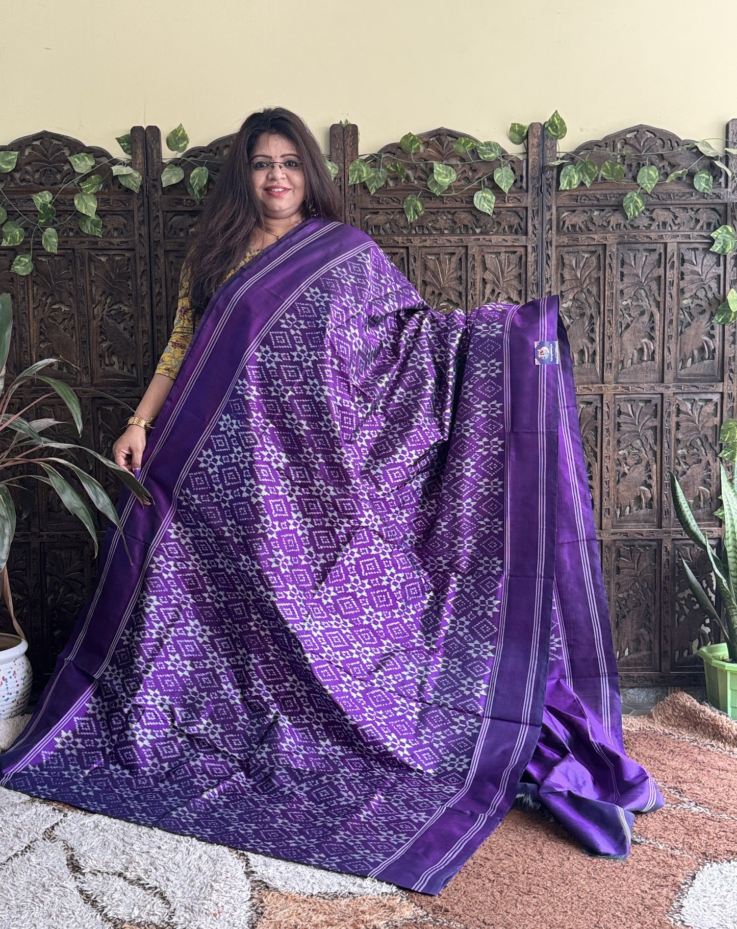 Ikkat Pattu Saree Violet colored complemented with a Patola border.