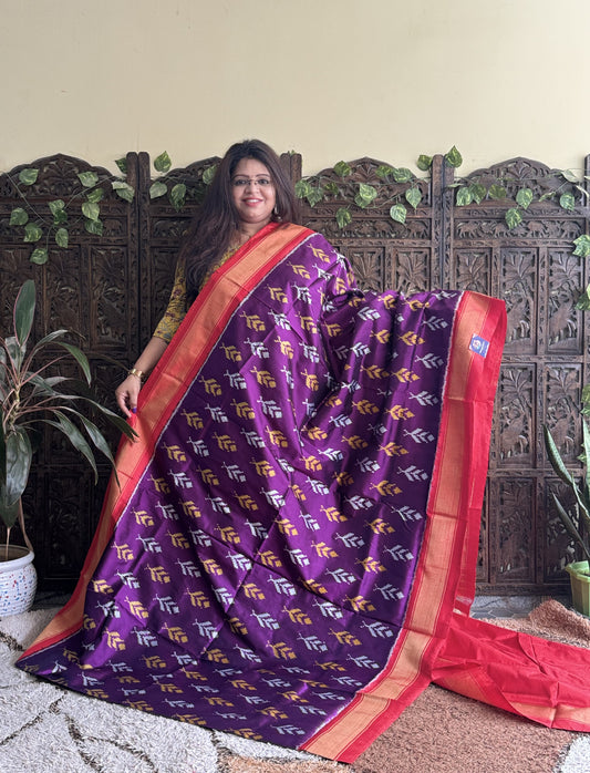 Ikkat Pattu Saree Dark Purple colored complemented with a Zari border.