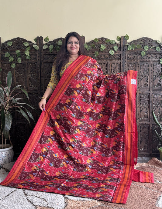 Ikkat Pattu Saree Red colored complemented with a Patola border.