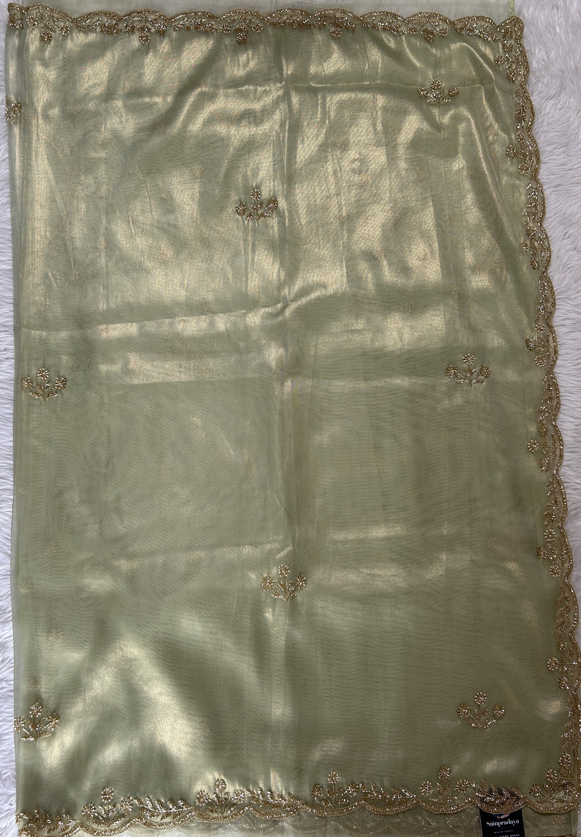 Tissue Organza Designer Saree Green colored Saree complemented with a Handcrafted border. - Sampradaya Designer Studio