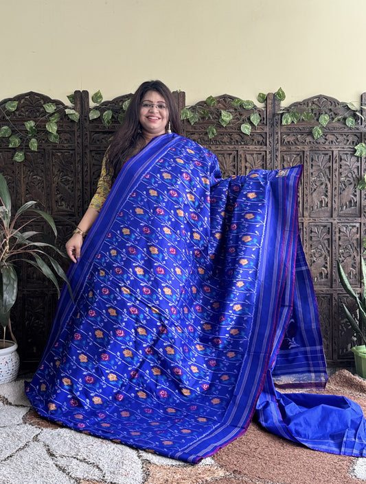 Ikkat Pattu Saree Sky Blue colored complemented with a Patola border.